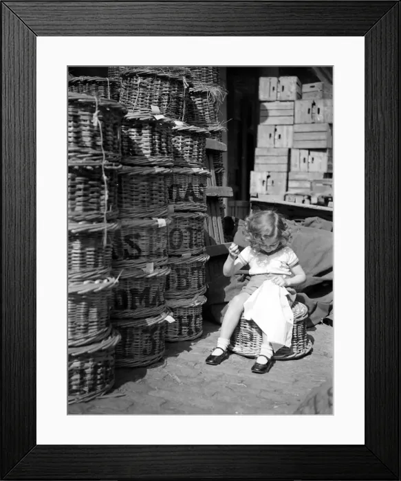 Framed Print : Little girl stitching her dress August 1941 Needle Work sewing basket Framed Print : Little girl stitching her dress August 1941 Needle Work sewing basket