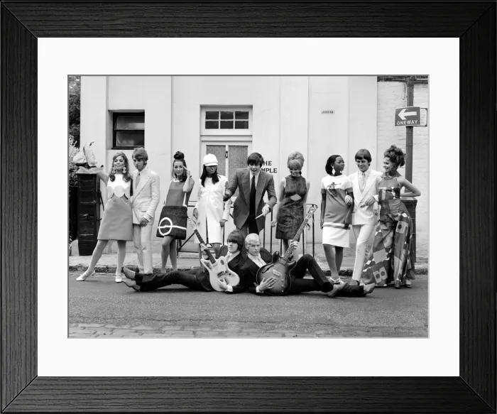 Framed Print : Brazilian fashion in London. Brazilian model posing with pop group The Move
