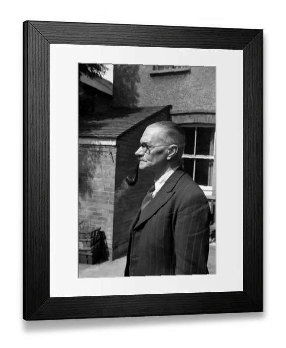 Framed Print : Smoking man (Mr. Brown) seen have smoking his Pipe. June 1953 D2984 Framed Print : Smoking man (Mr. Brown) seen have smoking his Pipe. June 1953 D2984