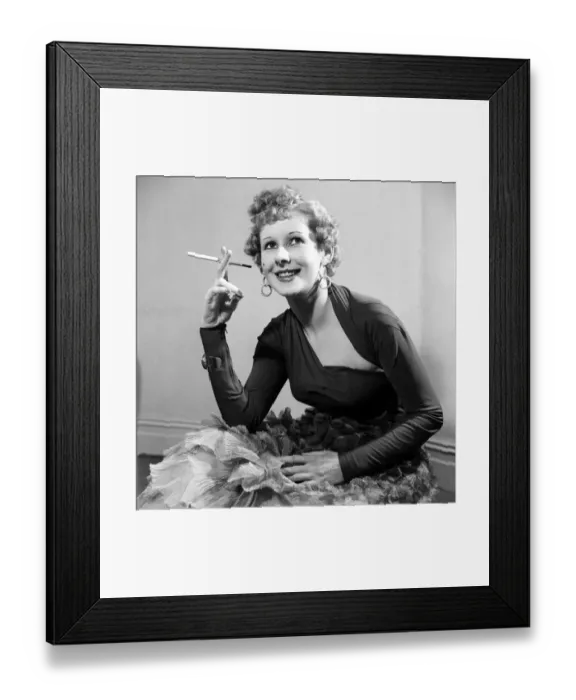 Framed Print : Model Gaby in a black jersey material dress with low cut neckline. March 1953 D1226-001