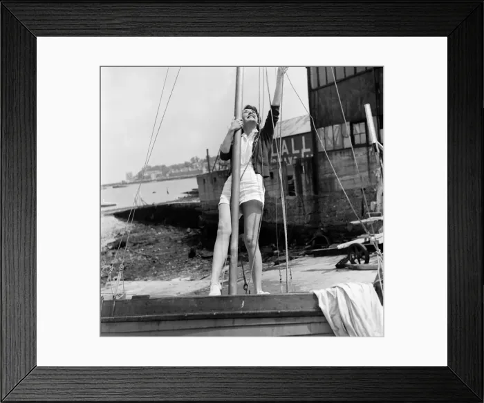 Framed Print : Woman inspect the rigging of her dinghy in preparation for the Isle of Wight Yacht Race Framed Print : Woman inspect the rigging of her dinghy in preparation for the Isle of Wight Yacht Race