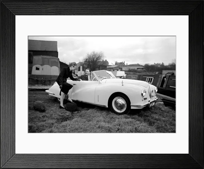Framed Print : Mrs. W. A. Hudson pointing out to a mechanic details for future models