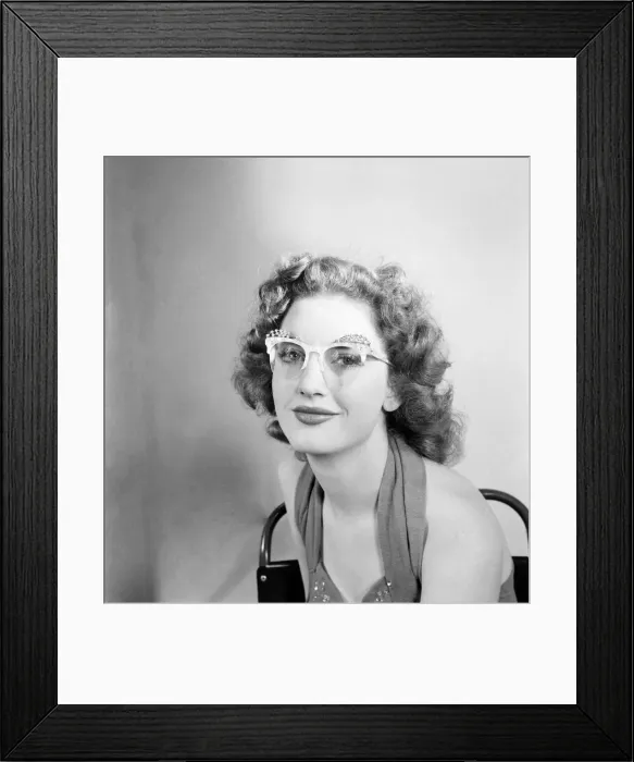 Framed Print : 19 Yrs old actress Shirley Lorimer displaying the spectacles. May 1953 D2541-002 Framed Print : 19 Yrs old actress Shirley Lorimer displaying the spectacles. May 1953 D2541-002