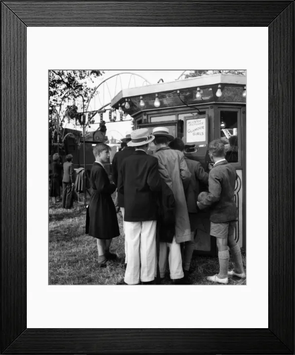 Framed Print : Boys at Henley queue to look at what the butler saw machine'. July 1953 D3393