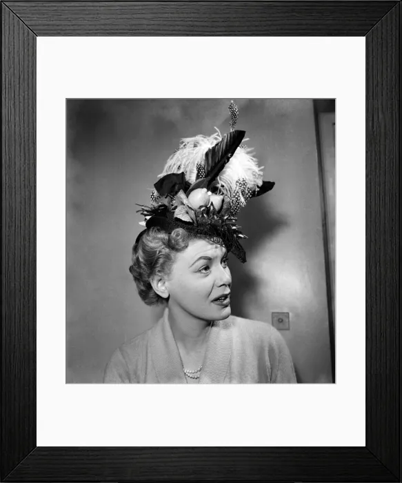 Framed Print : Jane Morgan In crazy hats she would like to wear. April 1953 D1685 Framed Print : Jane Morgan In crazy hats she would like to wear. April 1953 D1685