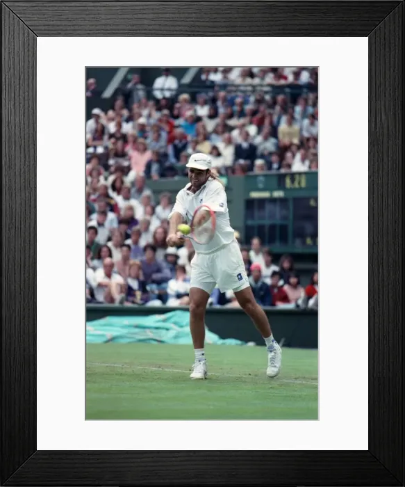 Framed Print : All England Lawn Tennis Championships at Wimbledon. Andre Agassi in action during Framed Print : All England Lawn Tennis Championships at Wimbledon. Andre Agassi in action during