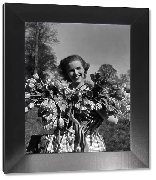 Actress Honor Blackman seen here with flowers in the gardens of Pinewood studio
