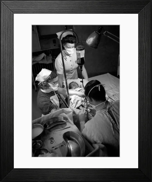 Framed Print : Hospital operation hearts. Babys life saved by blood transfusion. October 1946 O5112-004 Framed Print : Hospital operation hearts. Babys life saved by blood transfusion. October 1946 O5112-004