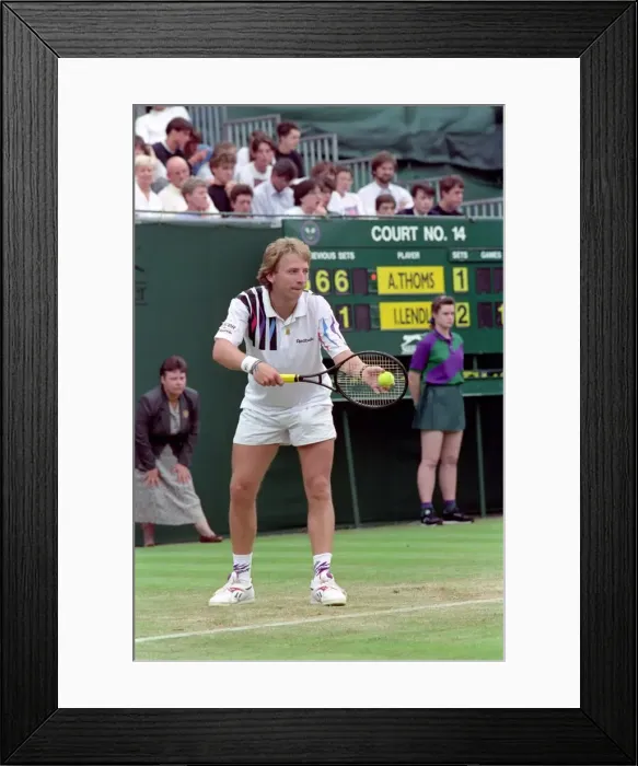 Framed Print : All England Lawn Tennis Championships at Wimbledon. Thoms in action during his Framed Print : All England Lawn Tennis Championships at Wimbledon. Thoms in action during his