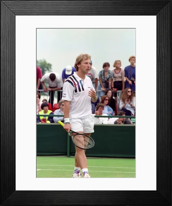 Framed Print : All England Lawn Tennis Championships at Wimbledon. Thoms in action during his Framed Print : All England Lawn Tennis Championships at Wimbledon. Thoms in action during his