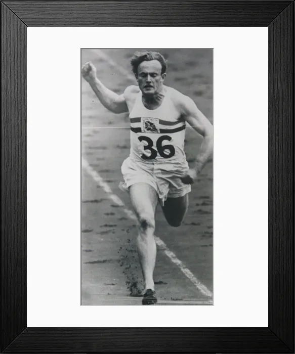 Framed Print : 1948 London Olympics A British competitor in crosses the finish line during