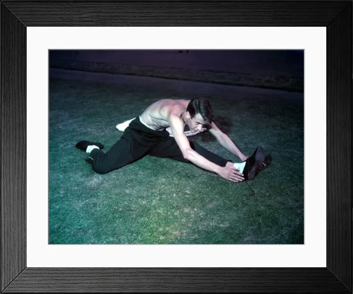 Framed Print : 1948 London Olympics in Colour. An athlete stretches
