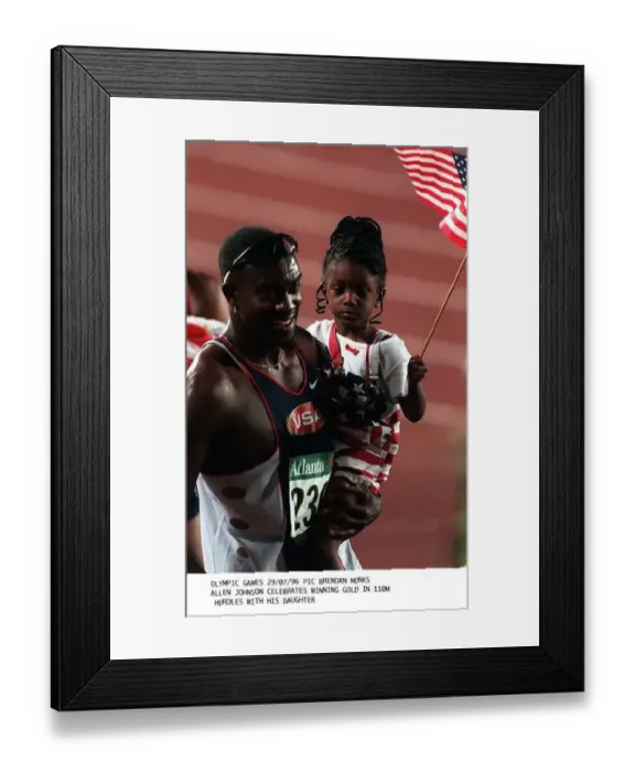  : Allen Johnson celebrates with his daughter after winning the gold medal in the 110 metres