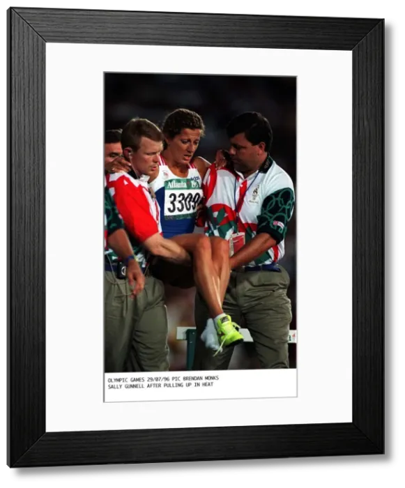 Framed Print : Sally Gunnell of Great Britain is carried away after collapsing in agony onto the track Framed Print : Sally Gunnell of Great Britain is carried away after collapsing in agony onto the track