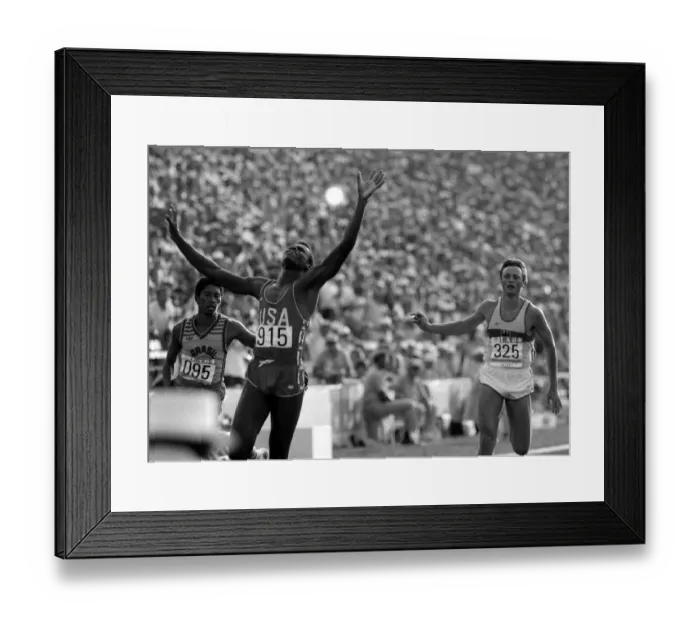 Framed Print : Carl Lewis of the United States of America wins gold in the Mens 200 meters Final Framed Print : Carl Lewis of the United States of America wins gold in the Mens 200 meters Final