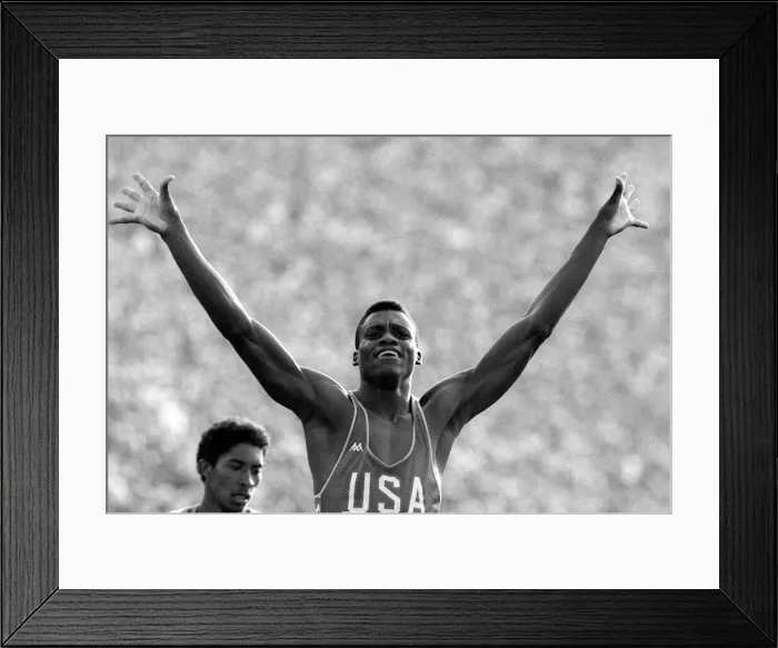 Framed Print : Carl Lewis of the United States of America wins gold in the Mens 200 meters Final Framed Print : Carl Lewis of the United States of America wins gold in the Mens 200 meters Final