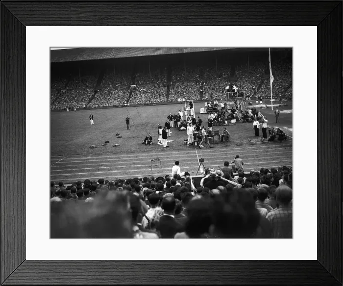 Framed Print : Marathon runner crosses the finish line at Wembley at London Olympic Games 1948 Framed Print : Marathon runner crosses the finish line at Wembley at London Olympic Games 1948