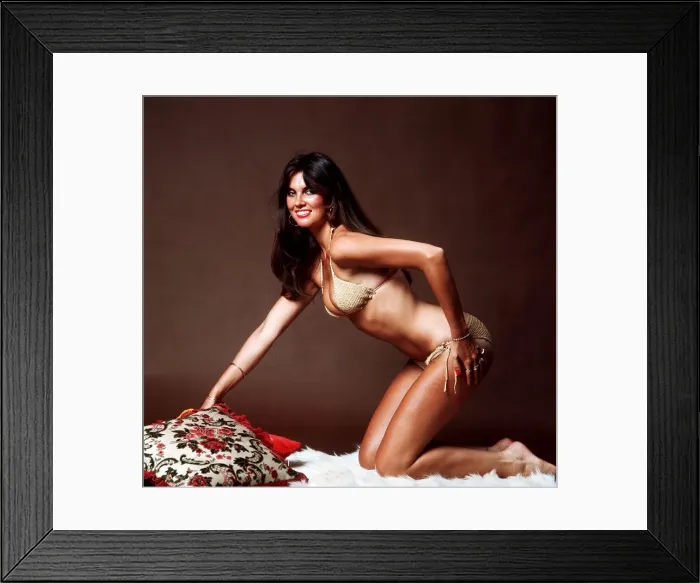 Framed Print : Actress Caroline Munro wearing gold bikini 1983 Played a James Bond girl in