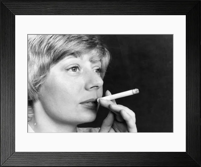 Framed Print : A picture of a woman (Posed model) smoking Framed Print : A picture of a woman (Posed model) smoking