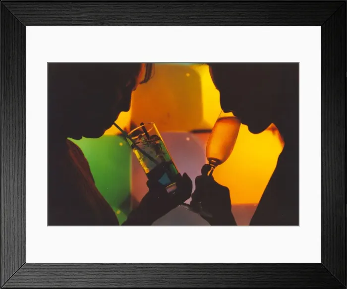 Framed Print : A picture of a woman drinking a cocktail enjoying a night out
