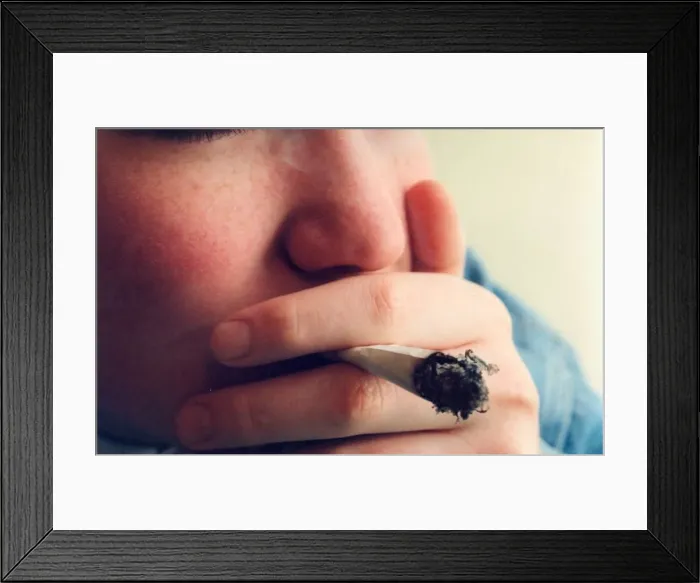 Framed Print : A posed model picture of an underage smoker Framed Print : A posed model picture of an underage smoker