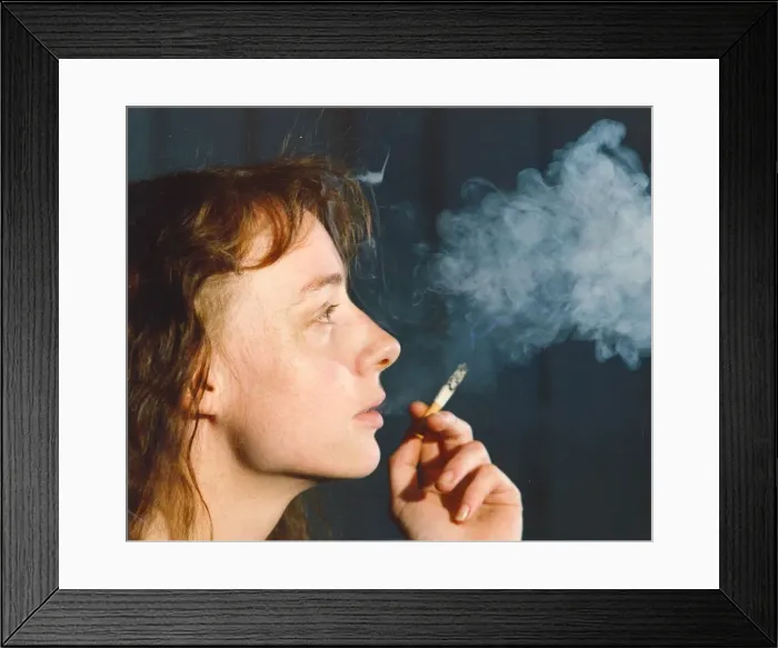 Framed Print : A picture of a woman (Posed model) smoking Framed Print : A picture of a woman (Posed model) smoking