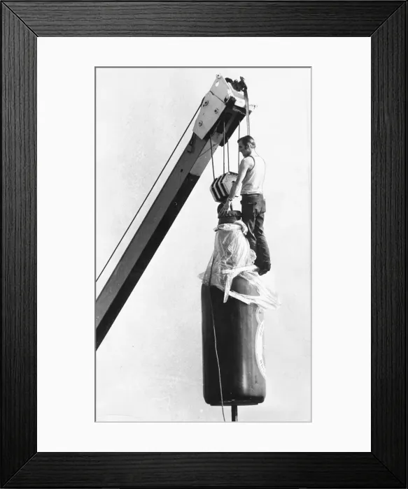 Framed Print : A very large bootle of beer being airlifted Framed Print : A very large bootle of beer being airlifted
