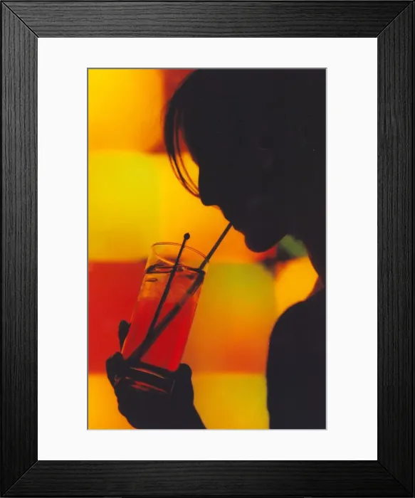 Framed Print : A picture of a woman drinking a cocktail enjoying a night out Framed Print : A picture of a woman drinking a cocktail enjoying a night out