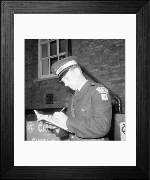 Framed Print : Traffic warden during training writing a fine fining uniform