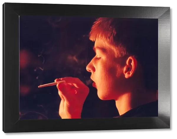 A posed model picture of an underage smoker 1st January 1990