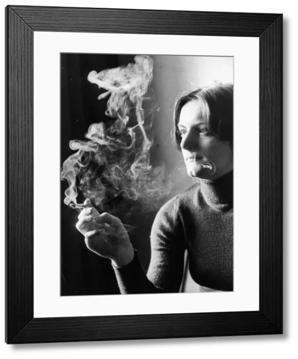Framed Print : Psychology student Adrianne Little smoking a cigarette Framed Print : Psychology student Adrianne Little smoking a cigarette