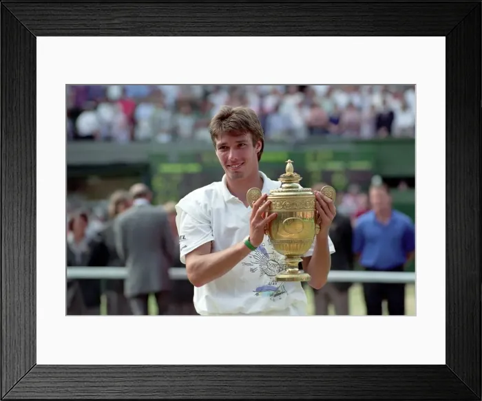 Framed Print : Wimbledon. Mens Final: Michael Stich Lifts Trophy. July 1991 91-4302-267