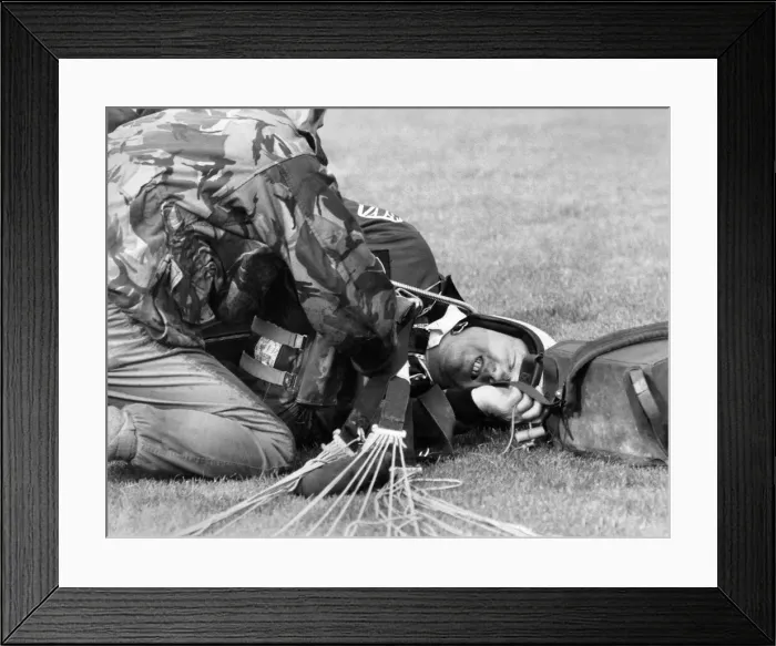 Framed Print : Tory member of Parliament Jack Aspinwall received attention from a soldier after he Framed Print : Tory member of Parliament Jack Aspinwall received attention from a soldier after he