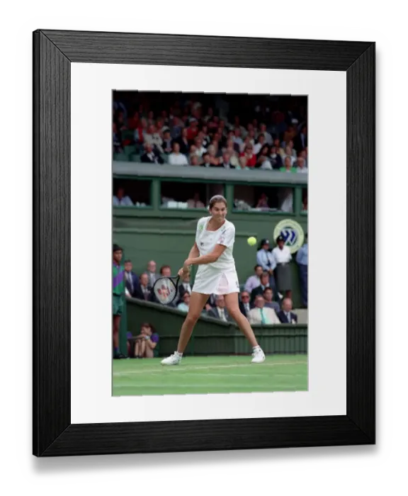 Framed Print : All England Lawn Tennis Championships at Wimbledon. Monica Seles in action during