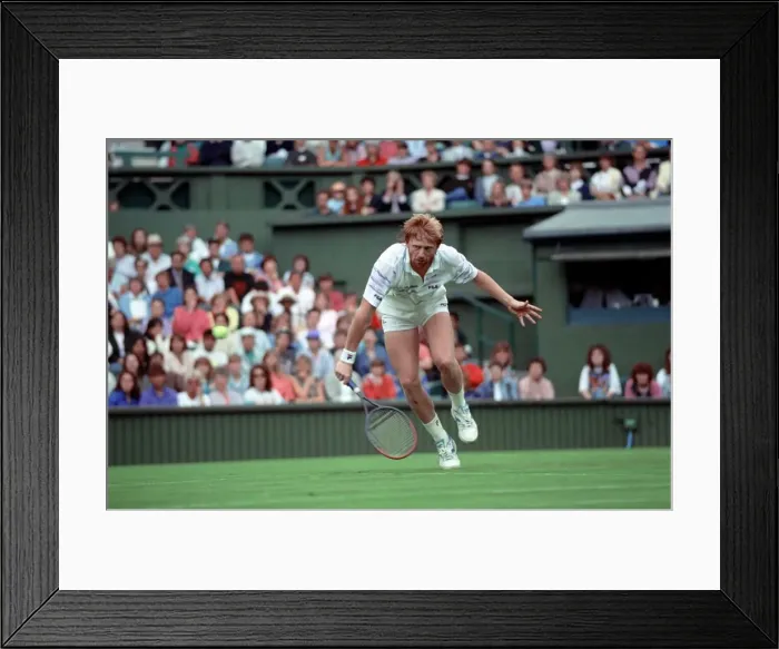 Framed Print : All England Lawn Tennis Championships at Wimbledon. Boris Becker in action against Omar