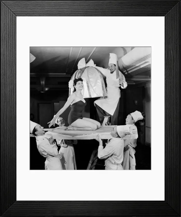 Framed Print : New Year Celebrations - Chefs at the Kensington Palace Hotel prepare a woman