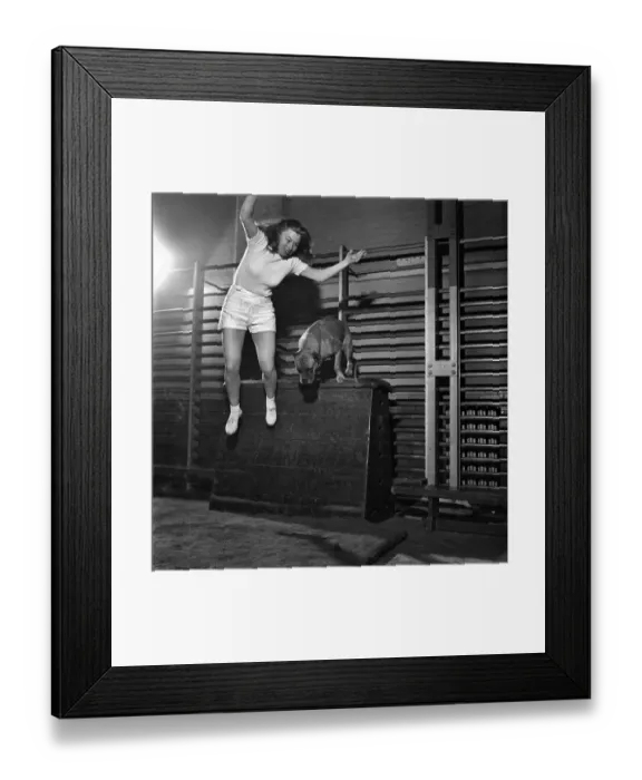 Framed Print : Janette Gay, a stunt girl in films, does toughening up exercises in a London gym