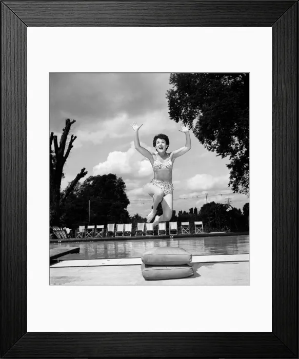 Framed Print : Stage and film actress Betty Paul wearing a bikini by the pool