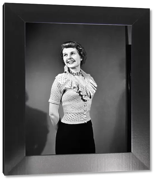 Sheila Sim is wearing frilly Jarnpon Blouse. February 1952 C6324