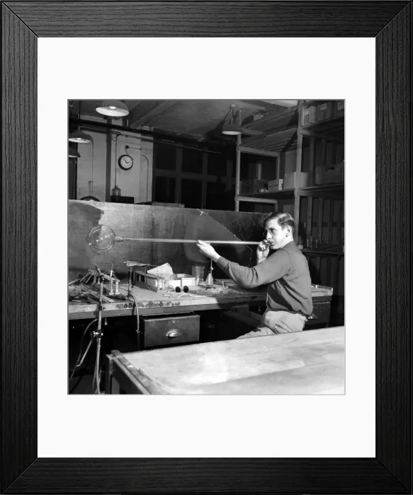 Framed Print : Glass blower Man blowing glass in his workshop. October 1952 C4910-001