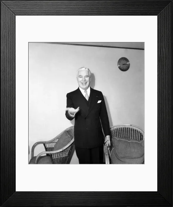 Framed Print : Charlie Chaplin being interviewed during his trip to the United Kingdom Framed Print : Charlie Chaplin being interviewed during his trip to the United Kingdom