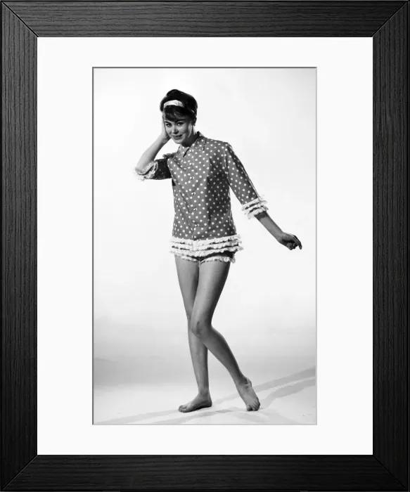 Framed Print : Model jackie Jackson seen here in the studio showing off the latest fashions which have a Framed Print : Model jackie Jackson seen here in the studio showing off the latest fashions which have a