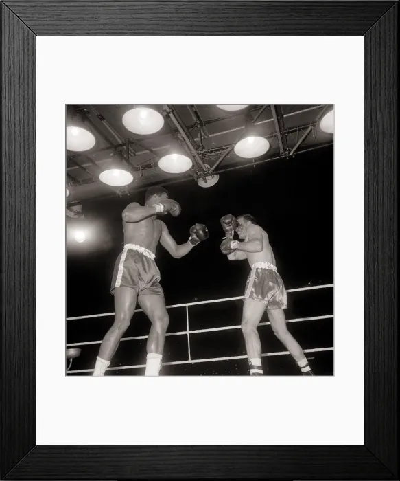 Framed Print : Action during the non-title heavyweight fight between American Cassius Clay Framed Print : Action during the non-title heavyweight fight between American Cassius Clay