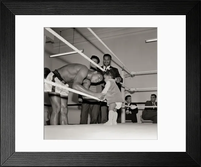 Framed Print : Cassius Clay, August 1966 With 12 months old Maria Morin