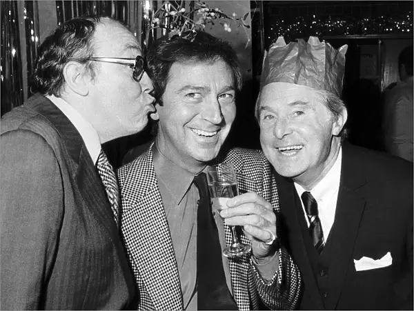 Morecambe and Wise with Des O Connor December 1982 sharing some christmas