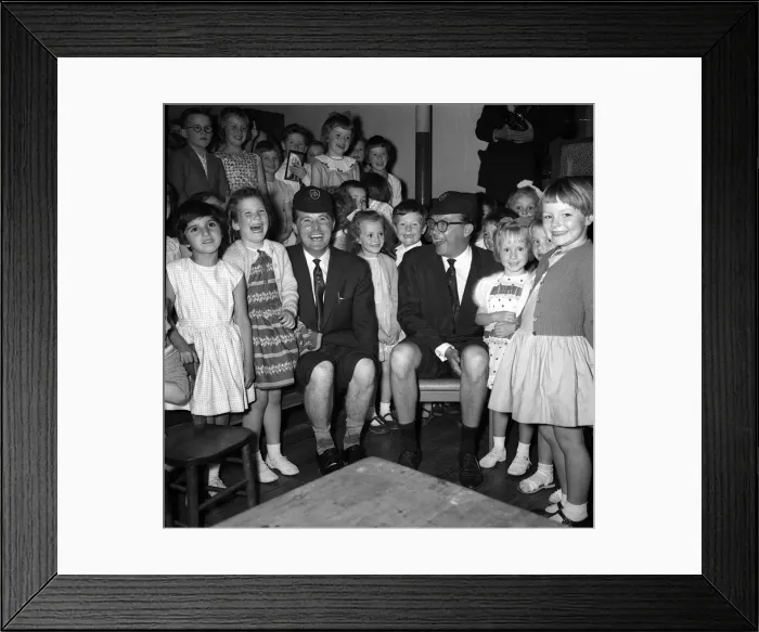 Framed Print : Morecambe & Wise with children of the Hamlet of Ratcliff school Stepney London wearing