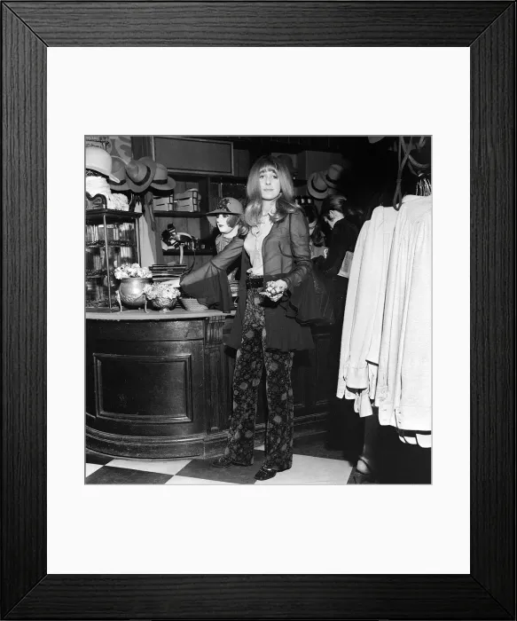 Framed Print : Boutique shop assistant Valerie Allen 19 holding flowers in the BIBA shop. London Framed Print : Boutique shop assistant Valerie Allen 19 holding flowers in the BIBA shop. London