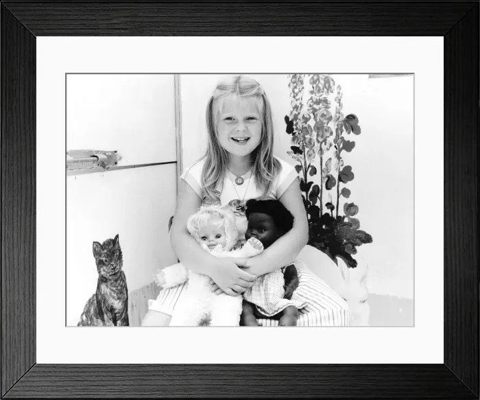 Framed Print : Louise Brown Test tube Girl holding dolls on her sith birthday July 1984 Framed Print : Louise Brown Test tube Girl holding dolls on her sith birthday July 1984