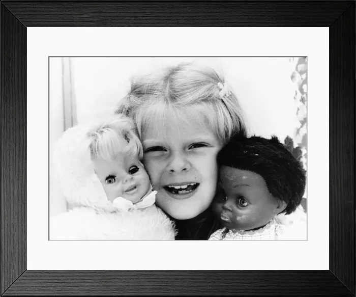 Framed Print : Louise Brown Test Tube Girl holding dolls July 1984 Framed Print : Louise Brown Test Tube Girl holding dolls July 1984
