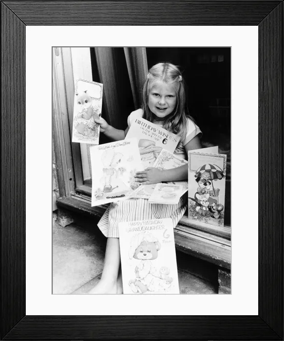 Framed Print : Louise Brown Test Tube Girl Holding birthday cards on her sixth birthday July1984